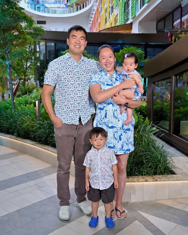 Jonathan with his wife and their two kids on vacation, all four smiling
