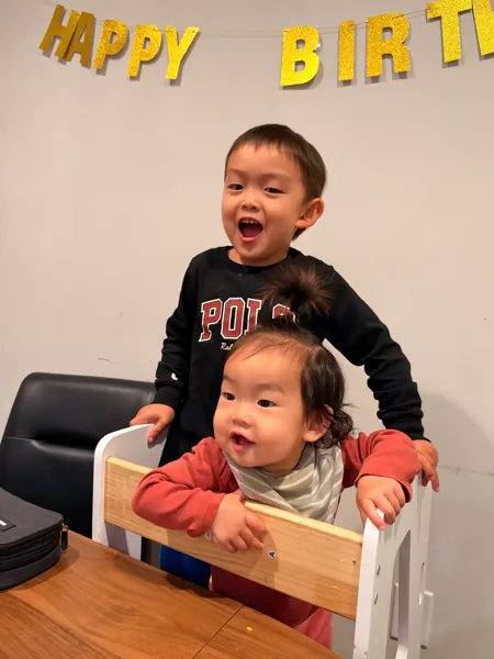 Jonathan’s son and daughter laughing together at the kitchen table